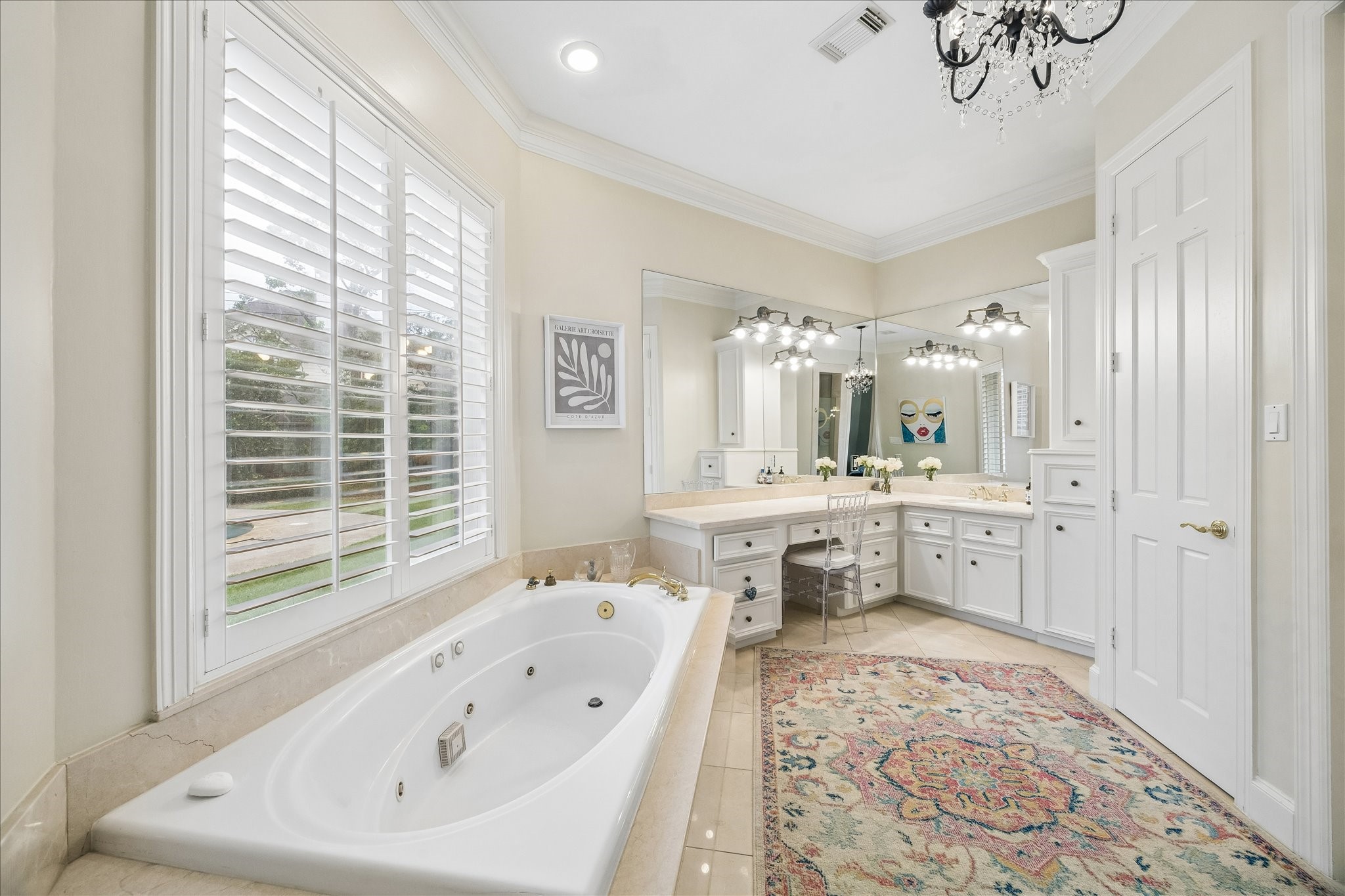 11421 Whippoorwill Road Houston, TX 77024 - Photo 15 of 33 a bathroom with a double vanity sink bathtub and next to a window