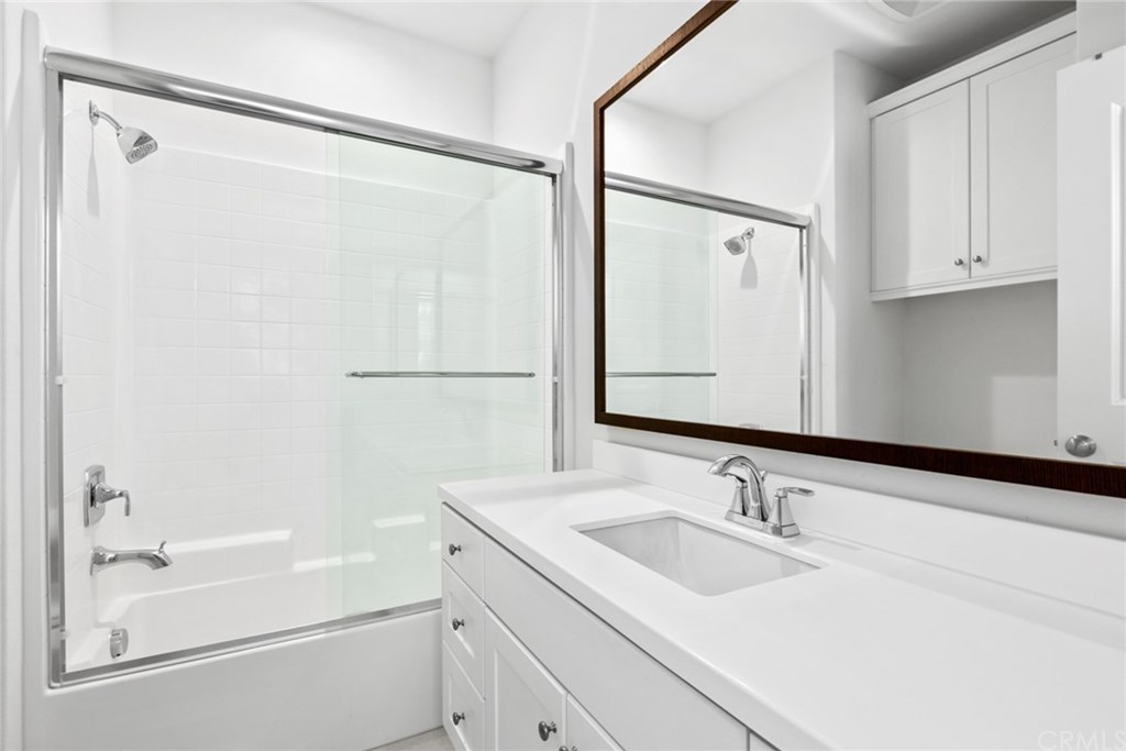 53 Kestrel Irvine, CA 92618 - Photo 23 of 39 Full size bathroom w/Moen fixtures, tub/shower combo w/ glass enclosure