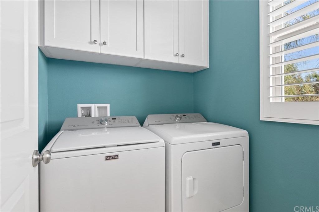 53 Kestrel Irvine, CA 92618 - Photo 24 of 39 Inside Laundry Room w/ Built-in Cabinets & Window for sunlight to peer in