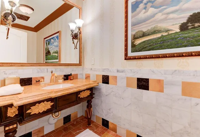 a bathroom with a sink and a mirror