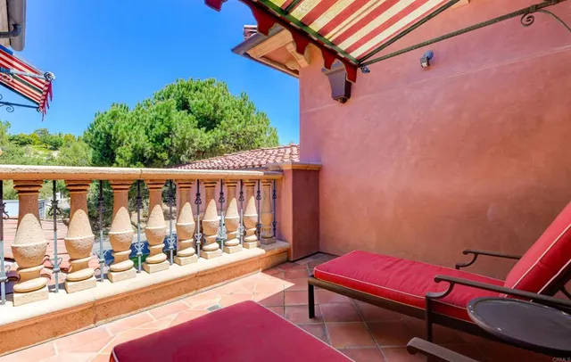 a blue bench sitting in front of a building