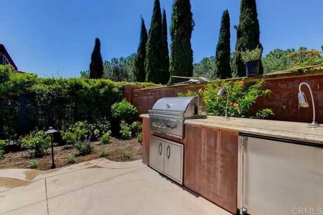 a view of a garden with an outdoor seating