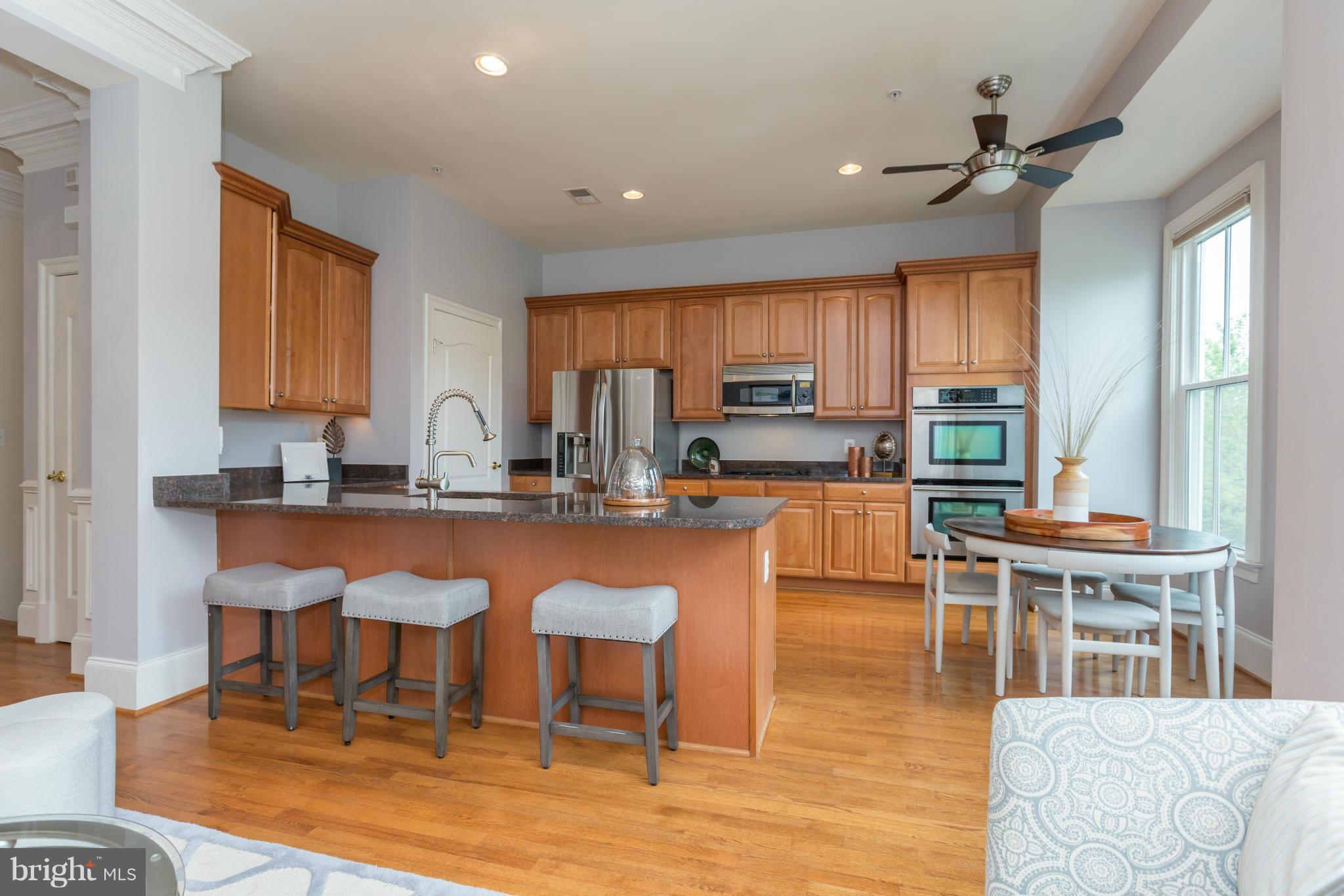 722 Carpenter Road Alexandria, VA 22314 - Photo 7 of 28 Long breakfast bar in kitchen