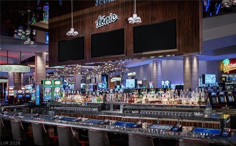 4381 West Flamingo Road, Unit 15310 Las Vegas, NV 89103 - Photo 32 of 52 Bar featuring a bar