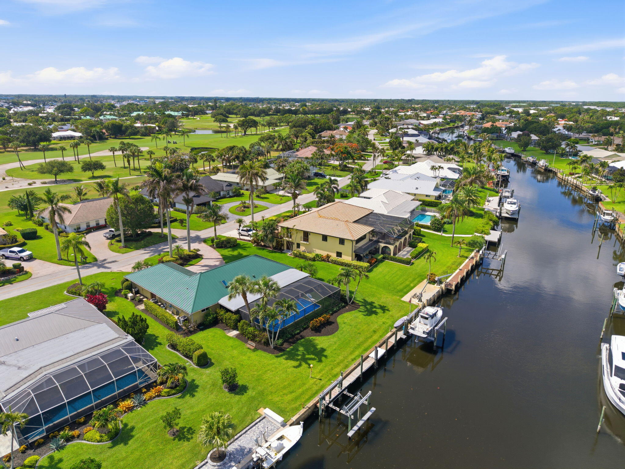 3374 Southeast Fairway East Stuart, FL 34997 - Photo 51 of 65 an aerial view of residential houses with outdoor space and ocean view