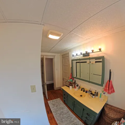 a room with stainless steel appliances furniture and a refrigerator