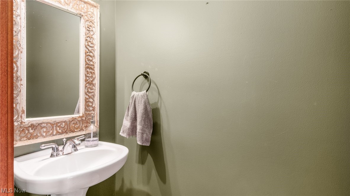 62960 James Road Cambridge, OH 43725 - Photo 11 of 40 I/2 Bathroom featuring a sink on main floor