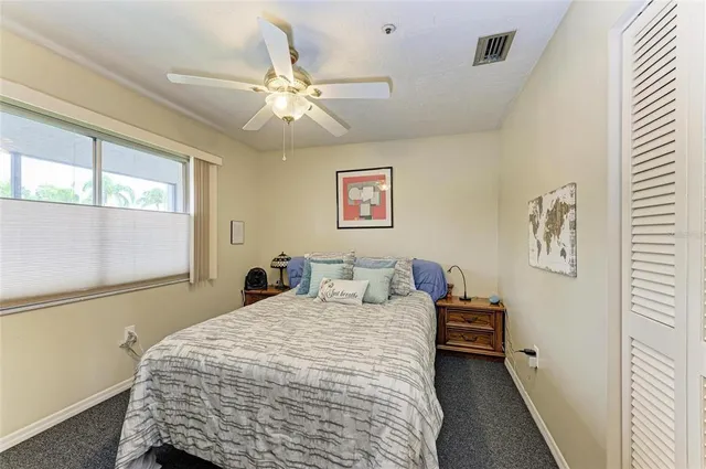 a bathroom with a sink vanity mirror and toilet