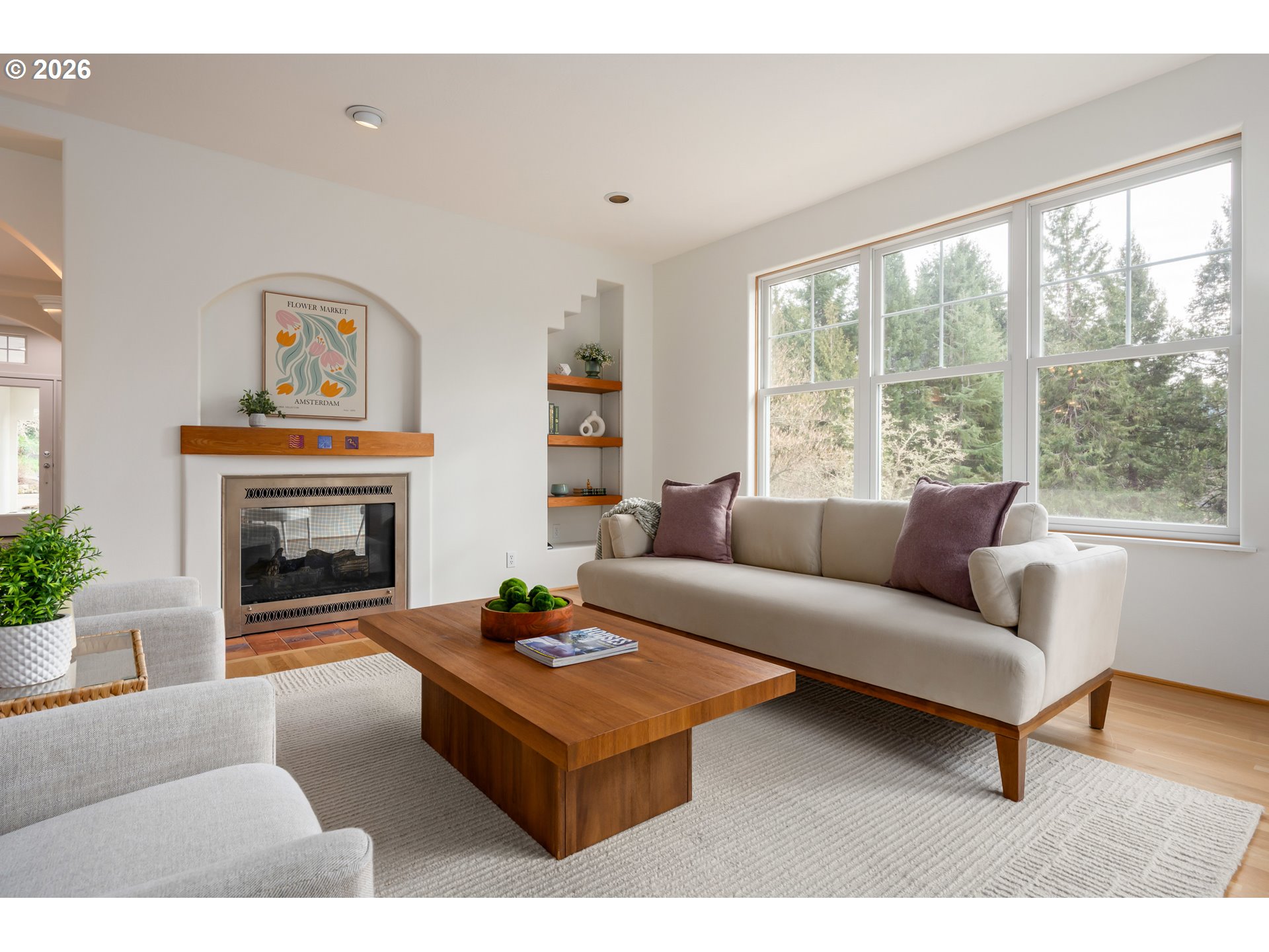4015 Spring Knoll Drive Eugene, OR 97405 - Photo 16 of 48 a living room with furniture a large window and a fireplace
