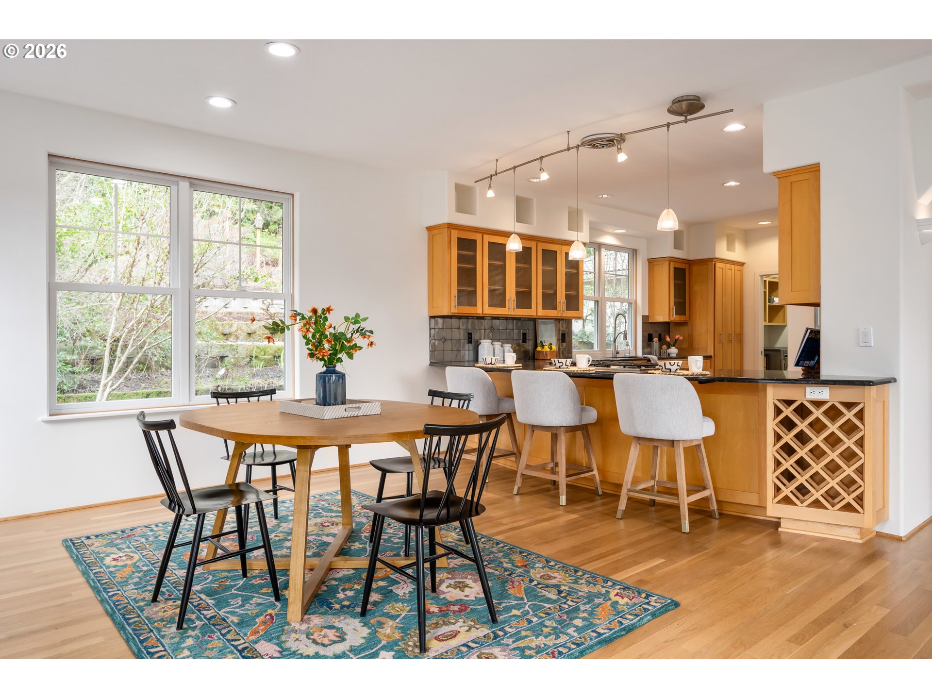 4015 Spring Knoll Drive Eugene, OR 97405 - Photo 19 of 48 a view of a dining room with furniture and wooden floor