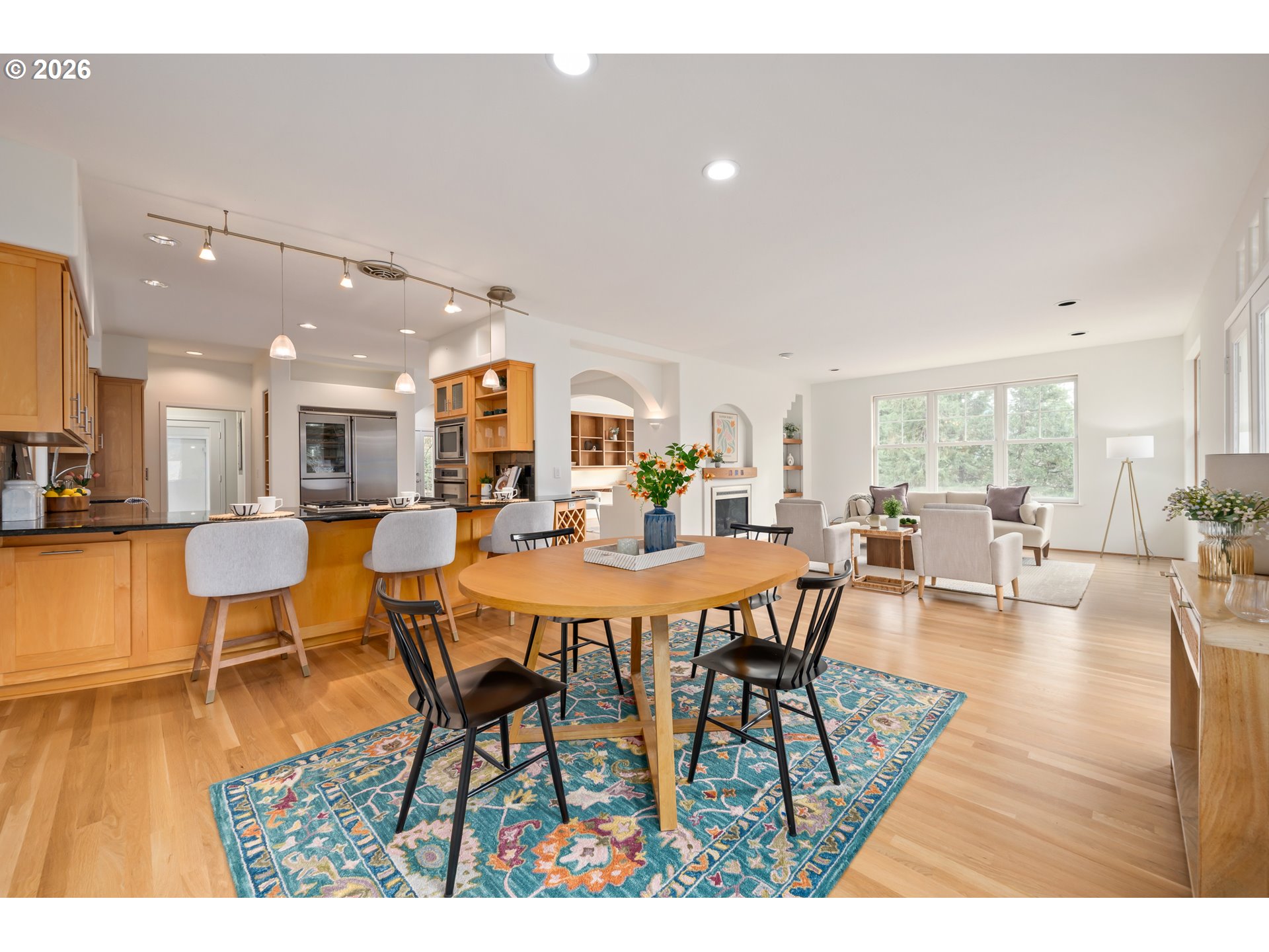 4015 Spring Knoll Drive Eugene, OR 97405 - Photo 20 of 48 a view of a dining room with furniture and wooden floor