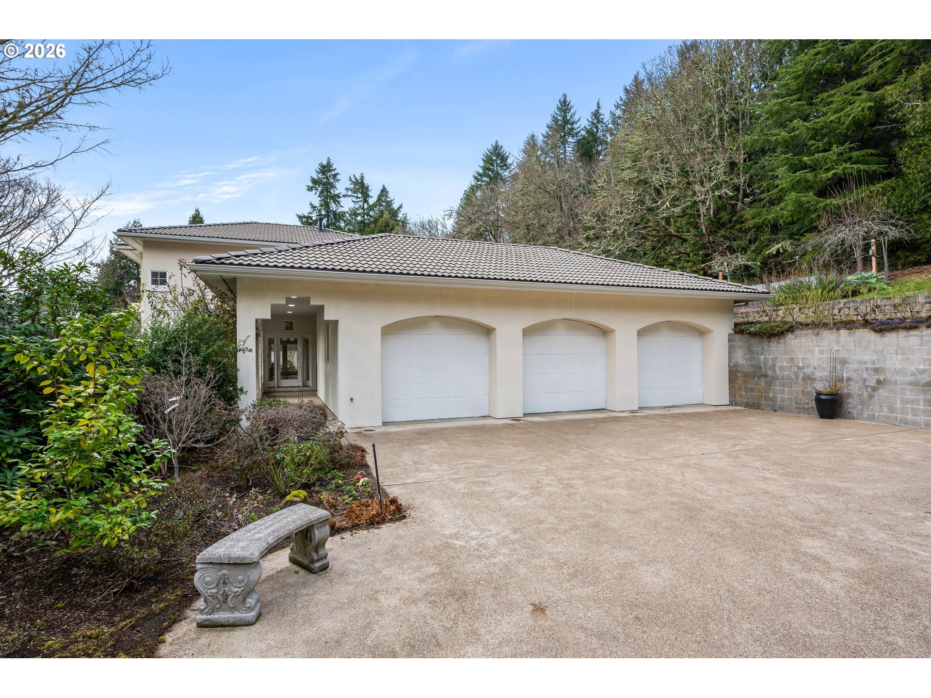 4015 Spring Knoll Drive Eugene, OR 97405 - Photo 2 of 48 a front view of a house with a yard and garage