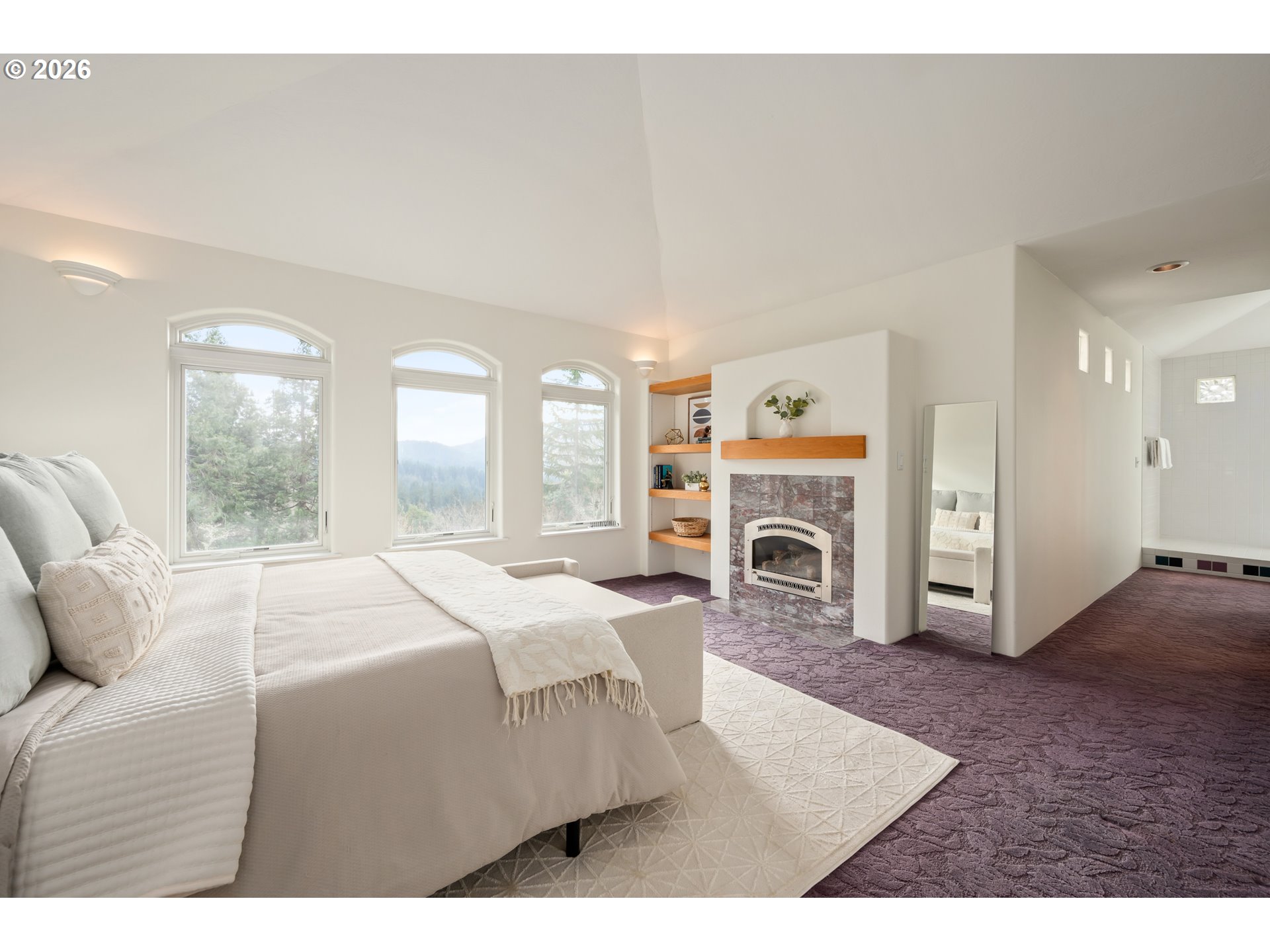 4015 Spring Knoll Drive Eugene, OR 97405 - Photo 22 of 48 a bed room with a bed and a fireplace