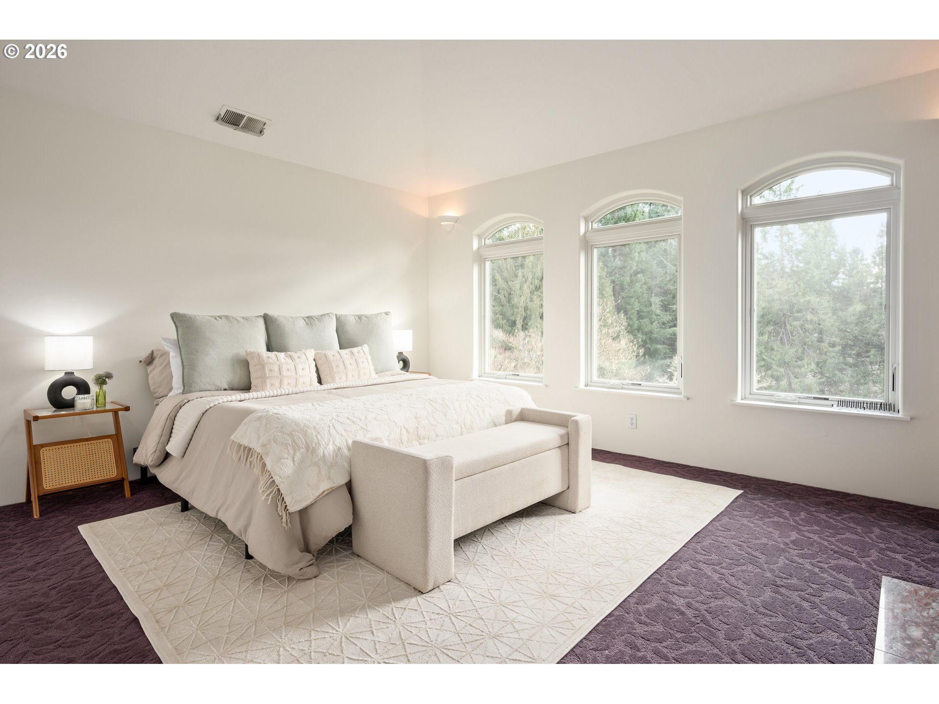 4015 Spring Knoll Drive Eugene, OR 97405 - Photo 23 of 48 a bedroom with a large bed and wooden floor