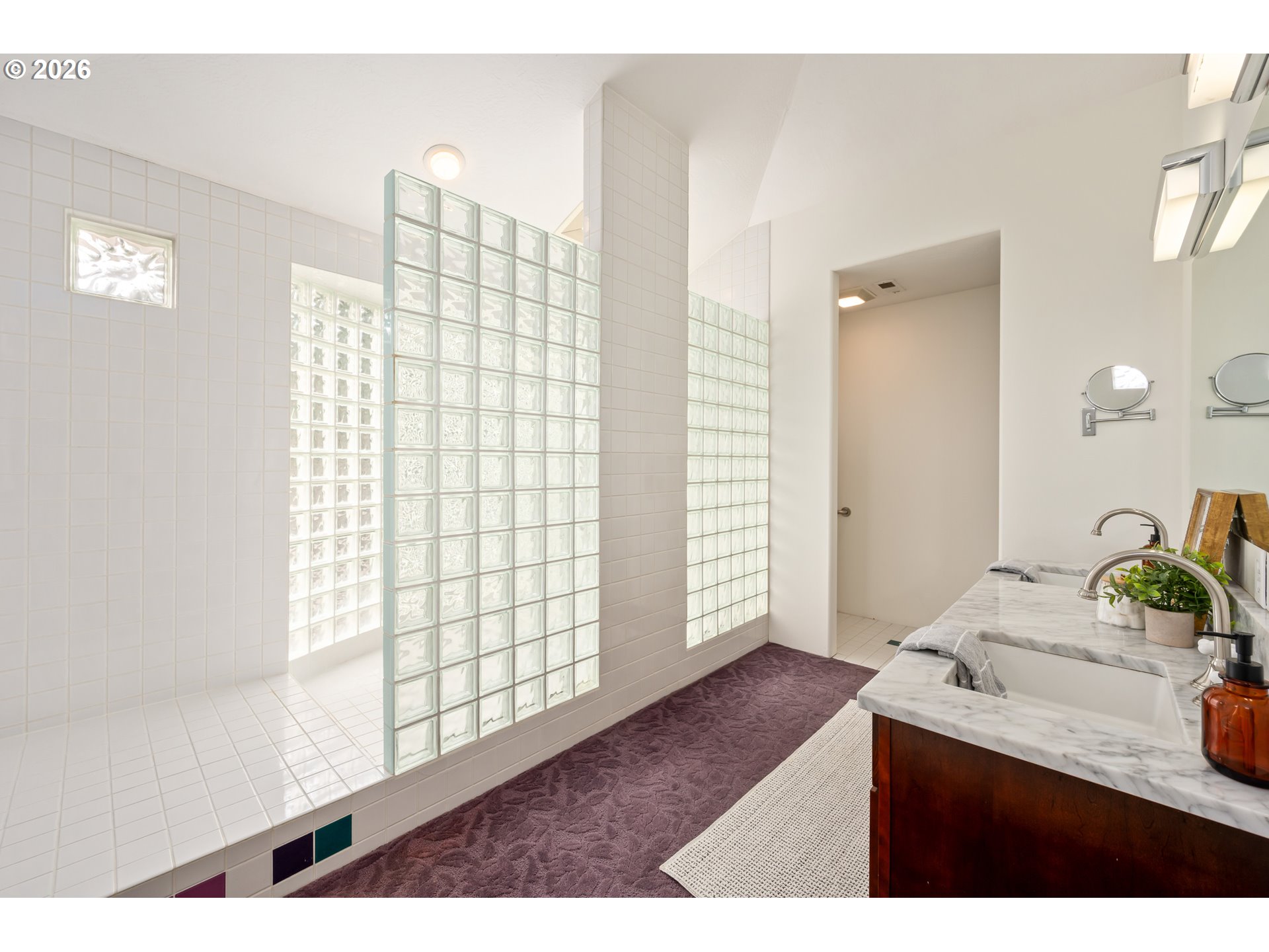 4015 Spring Knoll Drive Eugene, OR 97405 - Photo 25 of 48 a bathroom with a sink a mirror and next to a window