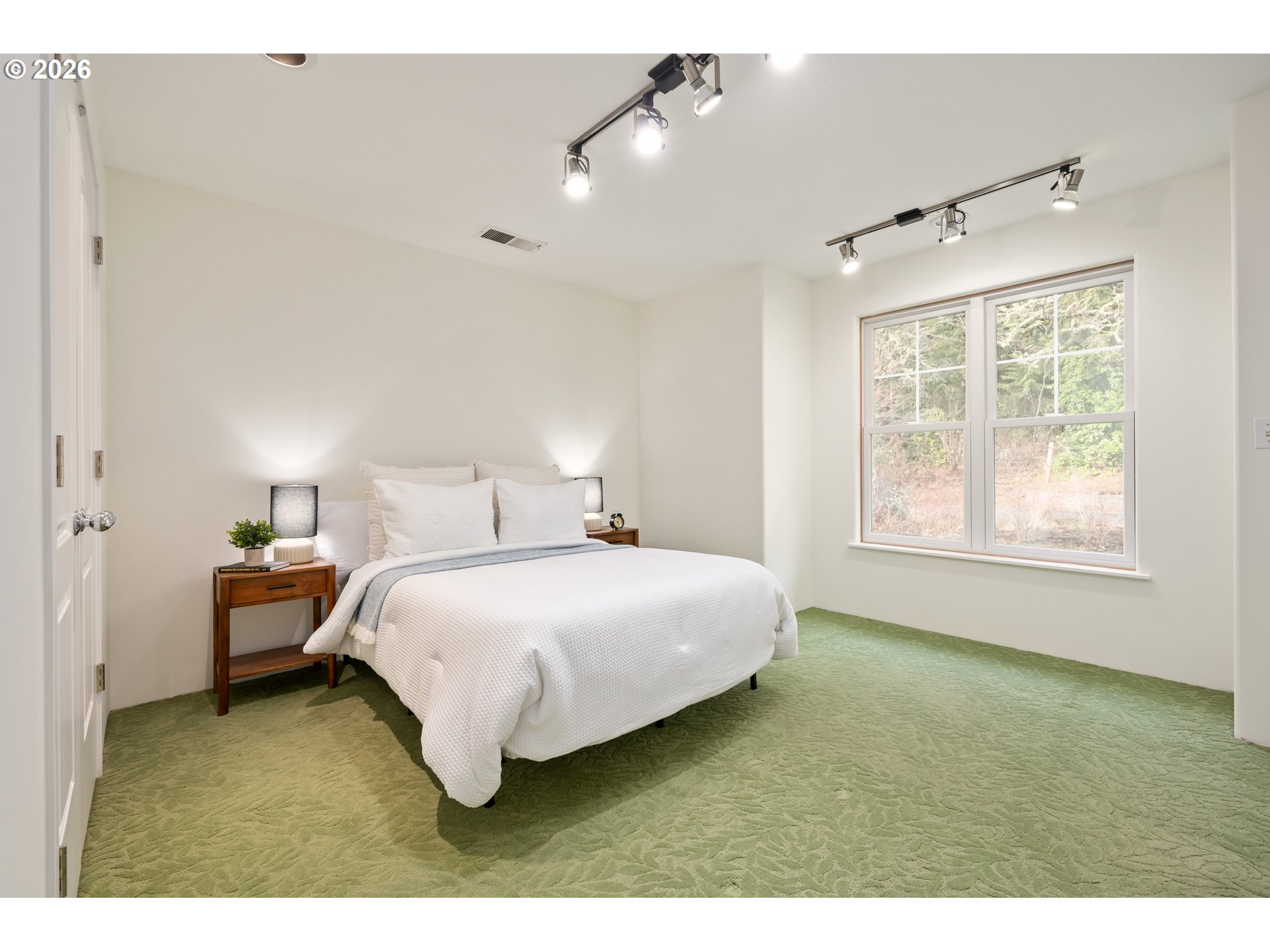 4015 Spring Knoll Drive Eugene, OR 97405 - Photo 30 of 48 a bedroom with a bed and a window