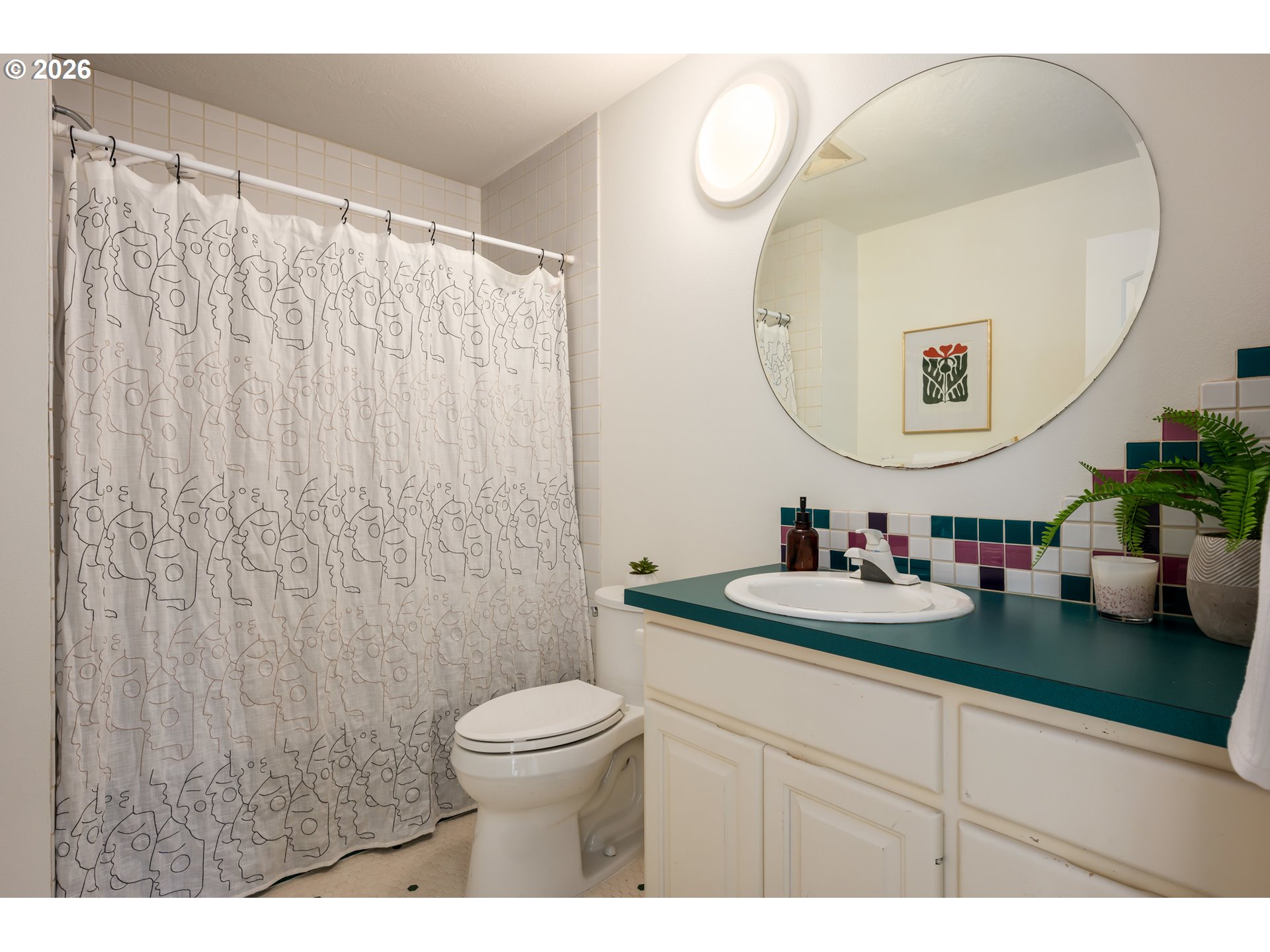 4015 Spring Knoll Drive Eugene, OR 97405 - Photo 33 of 48 a bathroom with a sink mirror and a toilet