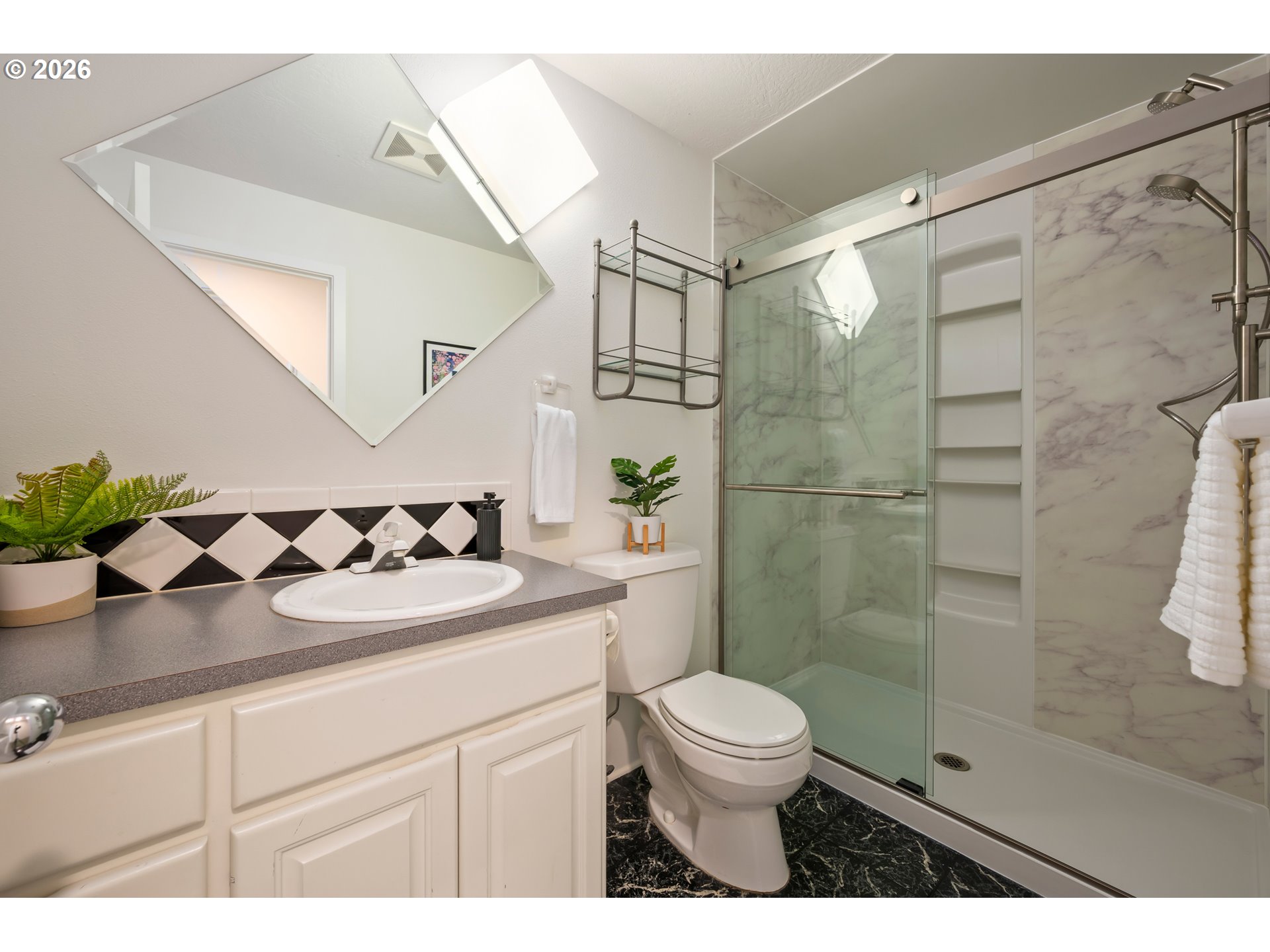 4015 Spring Knoll Drive Eugene, OR 97405 - Photo 38 of 48 a bathroom with a sink a toilet and shower