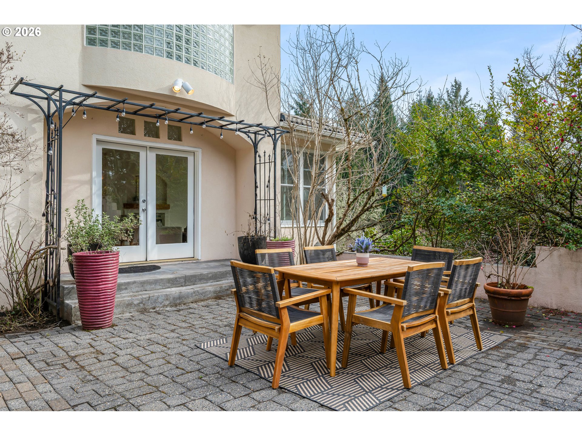 4015 Spring Knoll Drive Eugene, OR 97405 - Photo 41 of 48 a view of a patio with table and chairs and potted plants