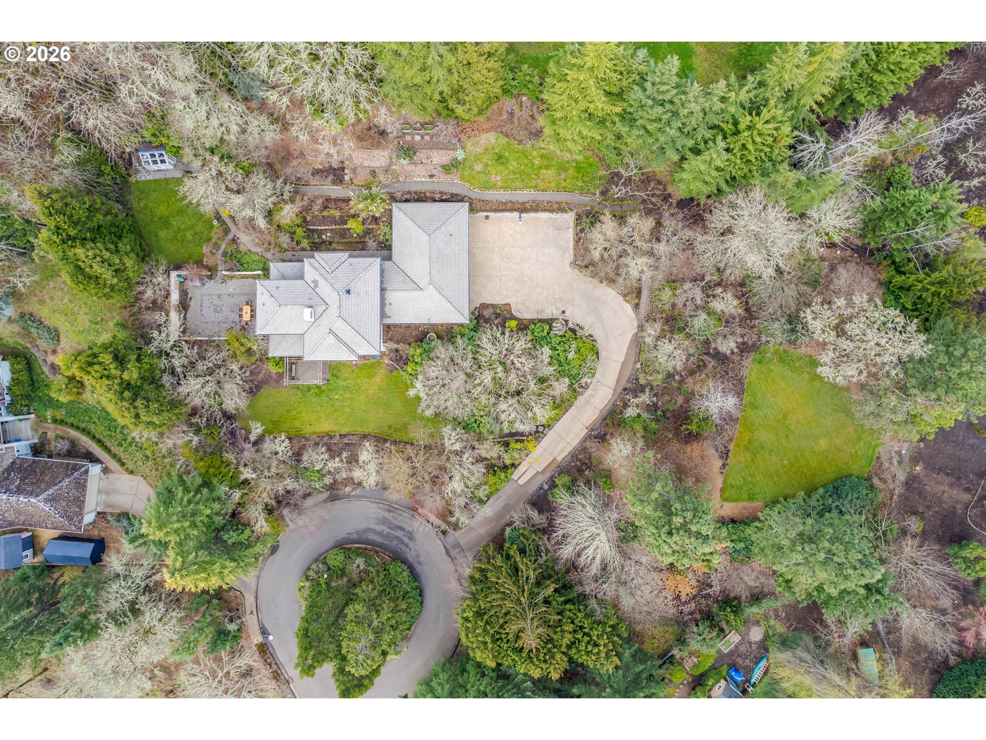 4015 Spring Knoll Drive Eugene, OR 97405 - Photo 47 of 48 an aerial view of a house with a yard lake and outdoor seating