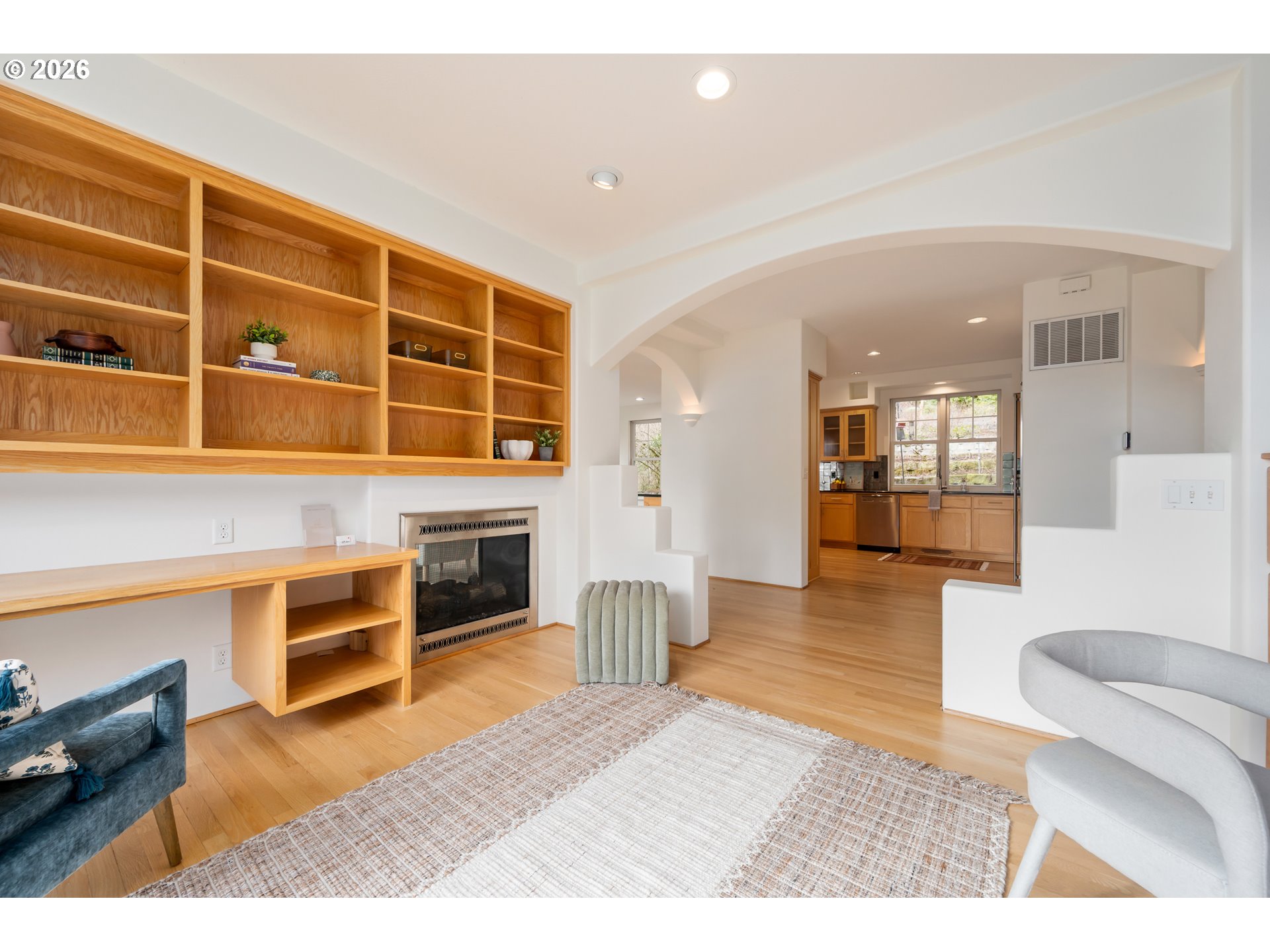 4015 Spring Knoll Drive Eugene, OR 97405 - Photo 8 of 48 a living room with furniture wooden floor and a kitchen view