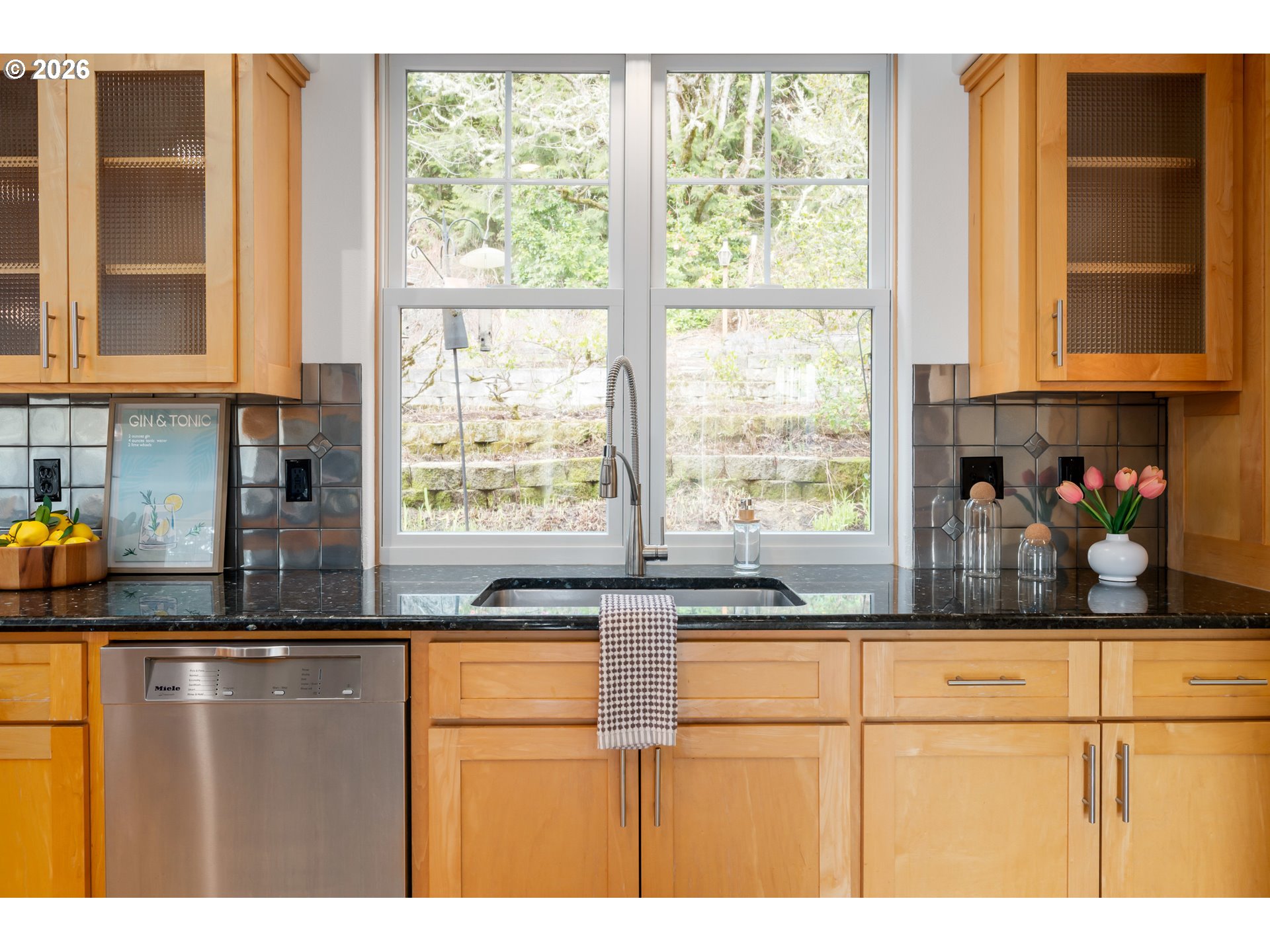 4015 Spring Knoll Drive Eugene, OR 97405 - Photo 10 of 48 a kitchen with stainless steel appliances granite countertop a sink and a window