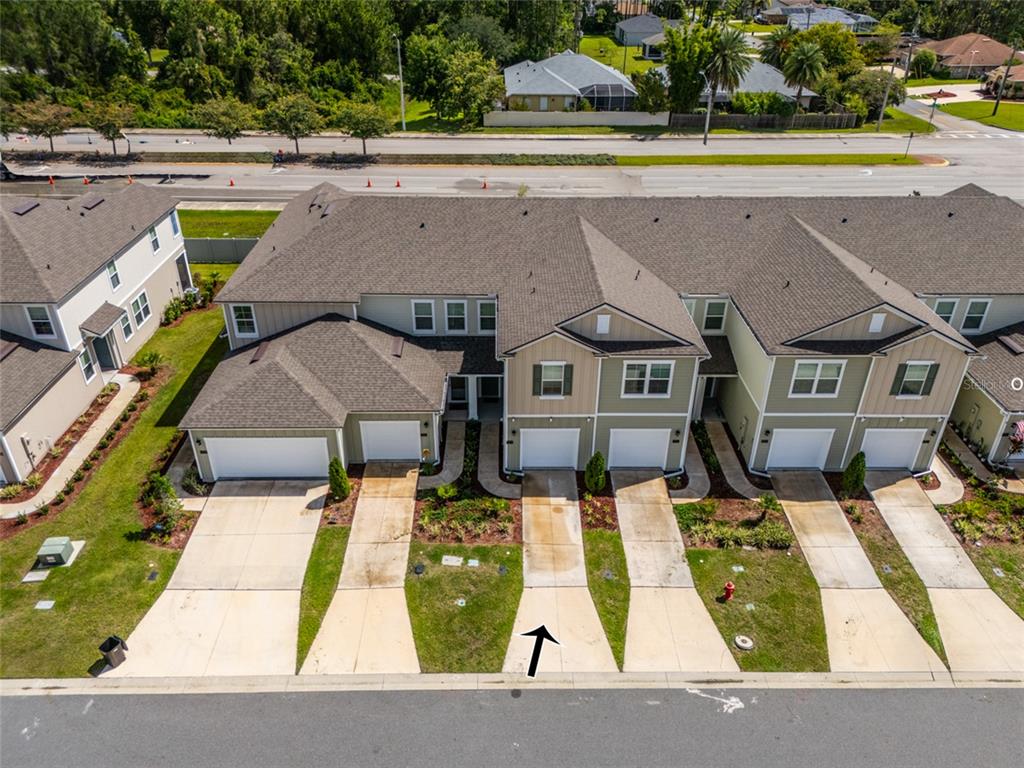 71 Redbud Road Palm Coast, FL 32137 - Photo 2 of 32 an aerial view of a house with a yard