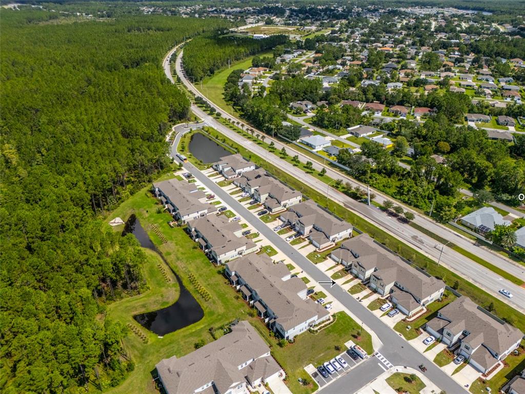 71 Redbud Road Palm Coast, FL 32137 - Photo 27 of 32 an aerial view of a residential houses with outdoor space