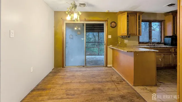 a view of a bathroom with sinks and shower doors