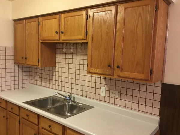 a bathroom with a sink a vanity and window