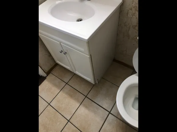 a bathroom with a sink and mirror