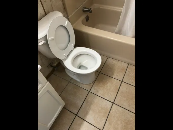 a bathroom with a toilet and a sink