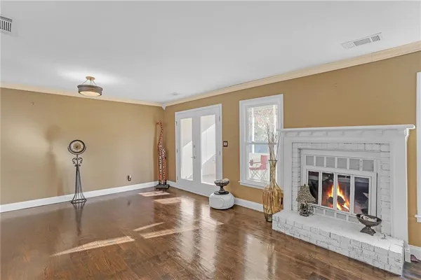 a living room with fireplace furniture and a fireplace