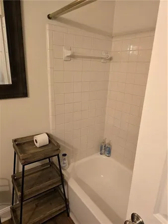 a bathroom with a shower and a sink