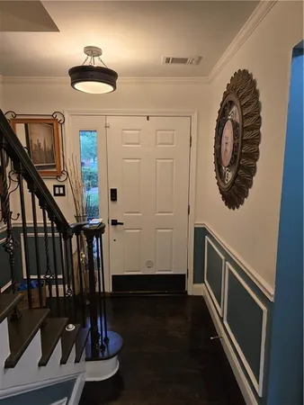 a view of entryway with wooden floor