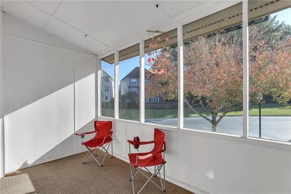 a living room with couch and a large window