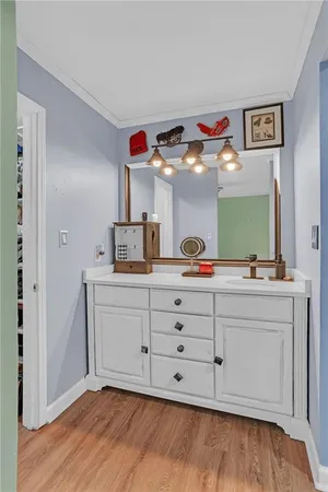 a spacious bathroom with a double vanity sink and a mirror