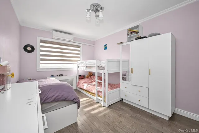 a bedroom with bed and window