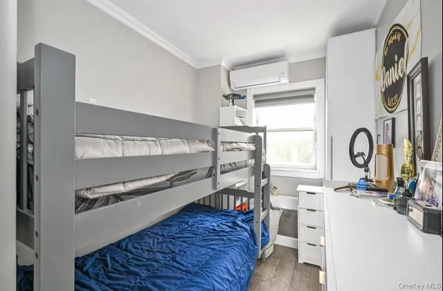 a bed room with a bed and a window