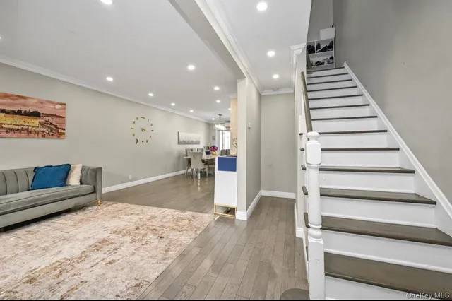 a view of a living room and entryway