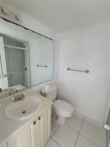 a view of a street with a big yard