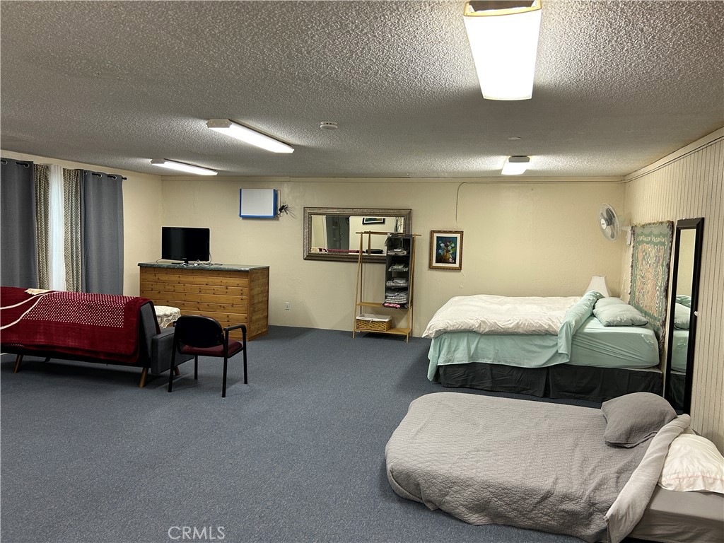 7025 Cuddy Valley Road, Unit F & H Frazier Park, CA 93225 - Photo 3 of 14 a bedroom with bed and window