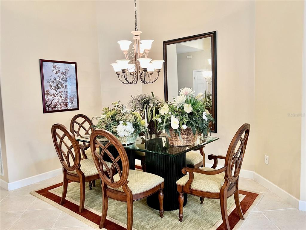 3304 Sunset Key Circle, Unit D Punta Gorda, FL 33955 - Photo 12 of 53 a view of a dining room with furniture window and wooden floor