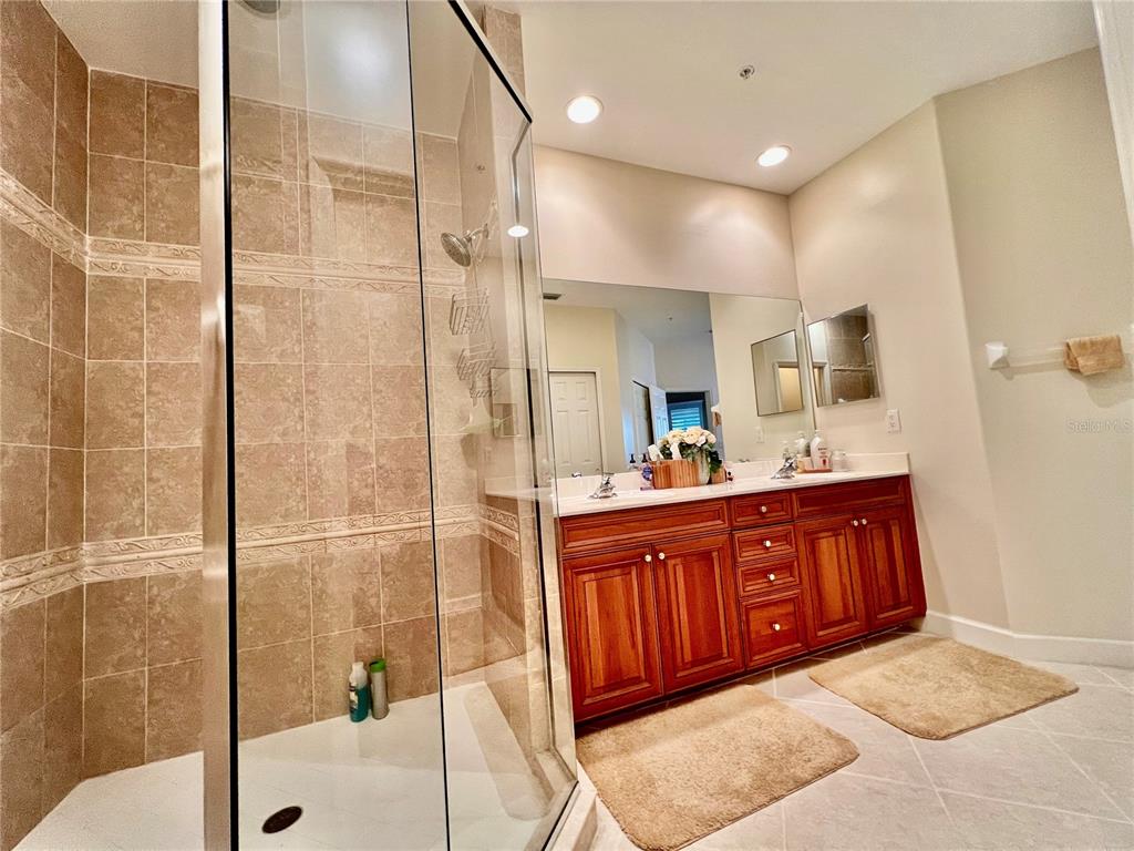 3304 Sunset Key Circle, Unit D Punta Gorda, FL 33955 - Photo 21 of 53 a bathroom with a sink and a mirror