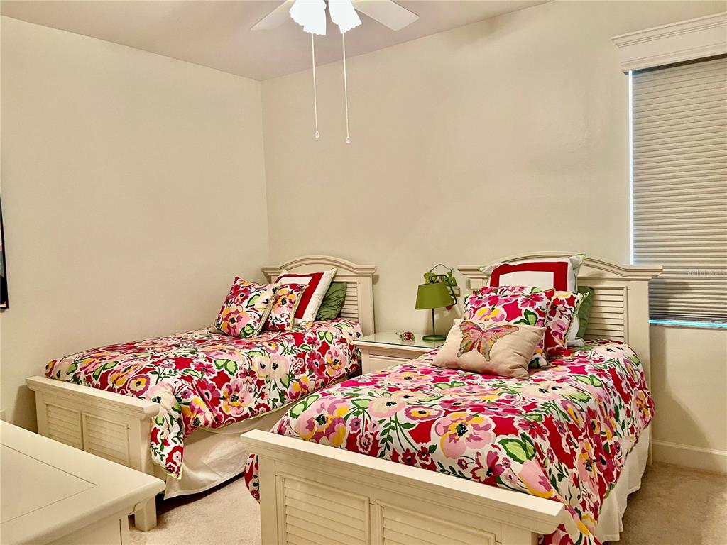 3304 Sunset Key Circle, Unit D Punta Gorda, FL 33955 - Photo 26 of 53 a bedroom with bed and a chandelier