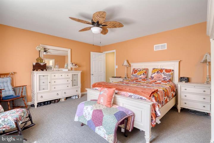 15-4 Cranberry Ridge Reading, PA 19606 - Photo 11 of 19 a bedroom with a bed and a dresser