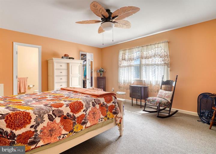 15-4 Cranberry Ridge Reading, PA 19606 - Photo 12 of 19 a bedroom with a bed a chair and large windows