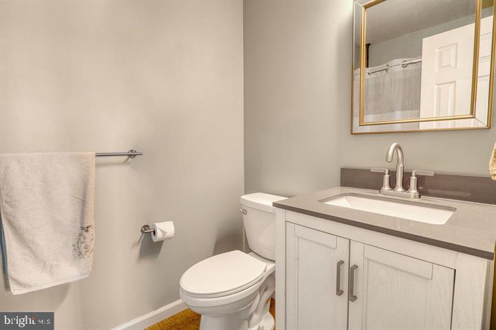 15-4 Cranberry Ridge Reading, PA 19606 - Photo 16 of 19 a bathroom with a granite countertop sink mirror vanity and toilet