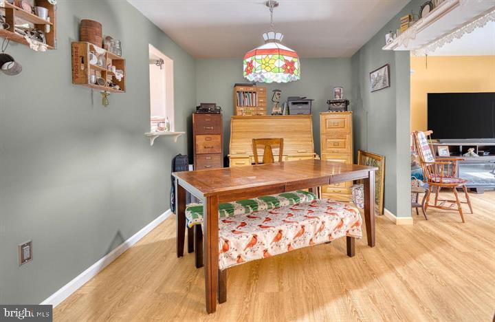 15-4 Cranberry Ridge Reading, PA 19606 - Photo 8 of 19 a view of a dining room with furniture and a flat screen tv