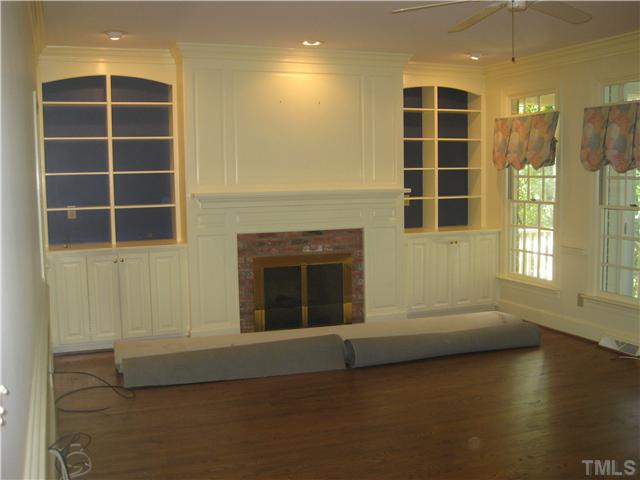 1429 Dogwood Lane Raleigh, NC 27607 - Photo 8 of 8 an empty room with windows and pillars in it